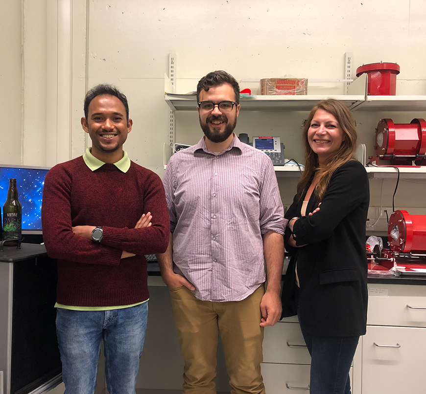University of Alberta graduate students Sourav Sarkar and Daniel Durnford with assistant professor Marie-Cécile Piro in Dr. Piro's lab. Photo by Suzette Chan.